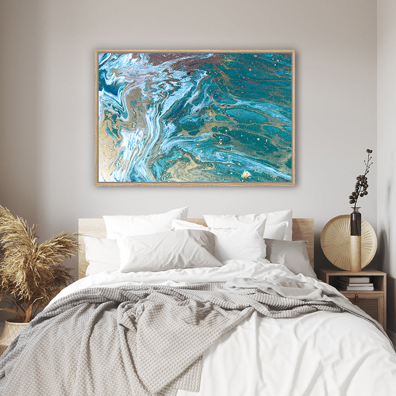 Turquoise and sandy grey canvas art print resembling surging ocean tides, in a coastal-style bedroom.